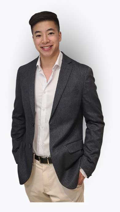tim-cheng-standing-in-blazer-jacket-with-welcoming-smile